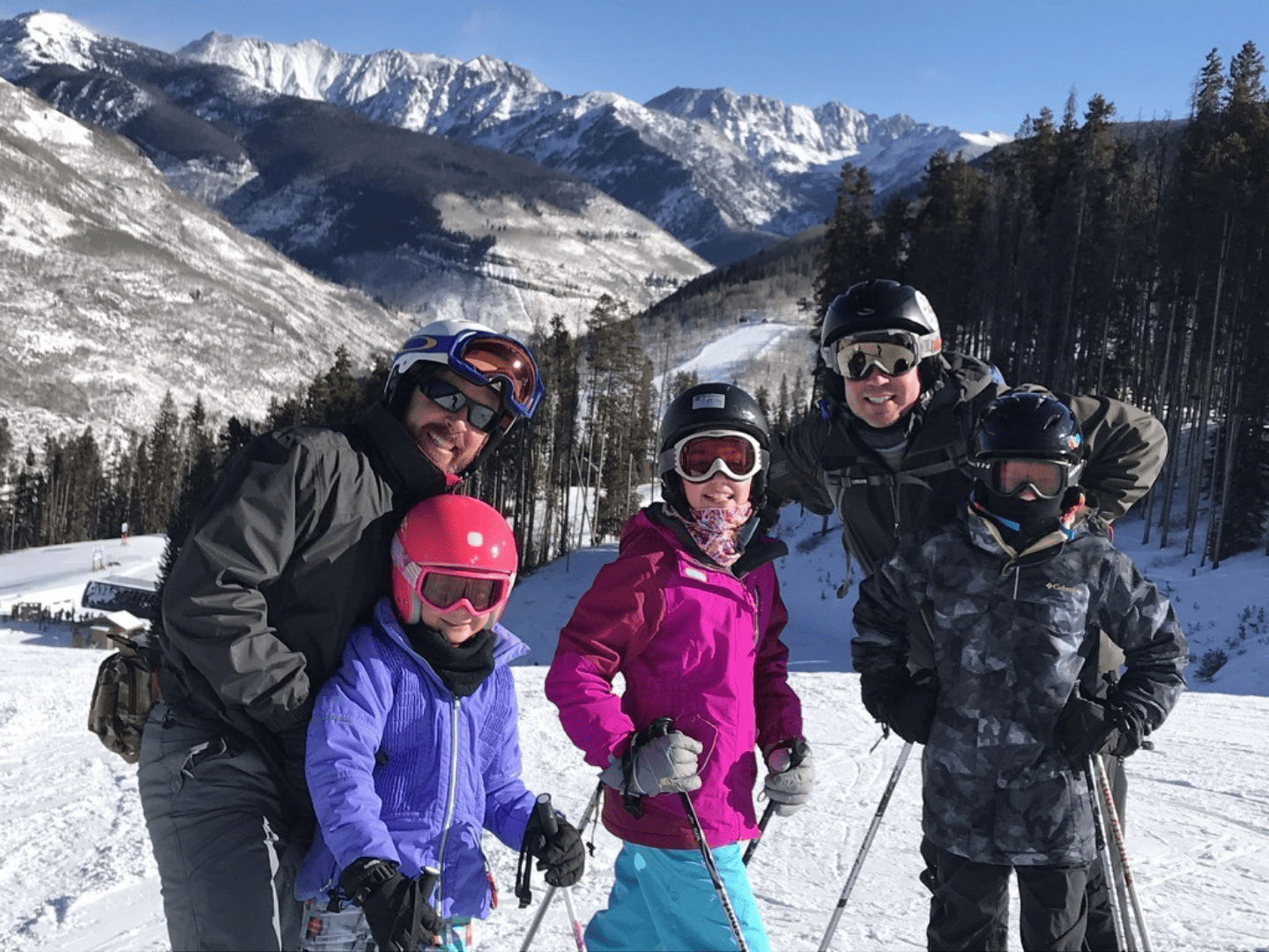 A group of skiers together in the Colorado mountains